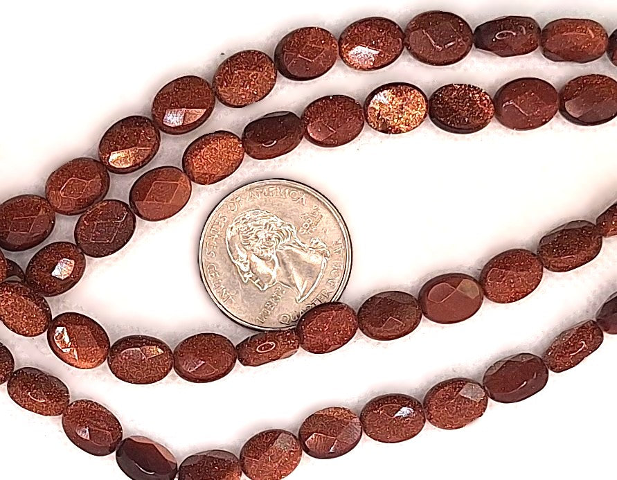 10x8mm Goldstone Faceted Puff Oval Gemstone Beads 8-Inch Strand